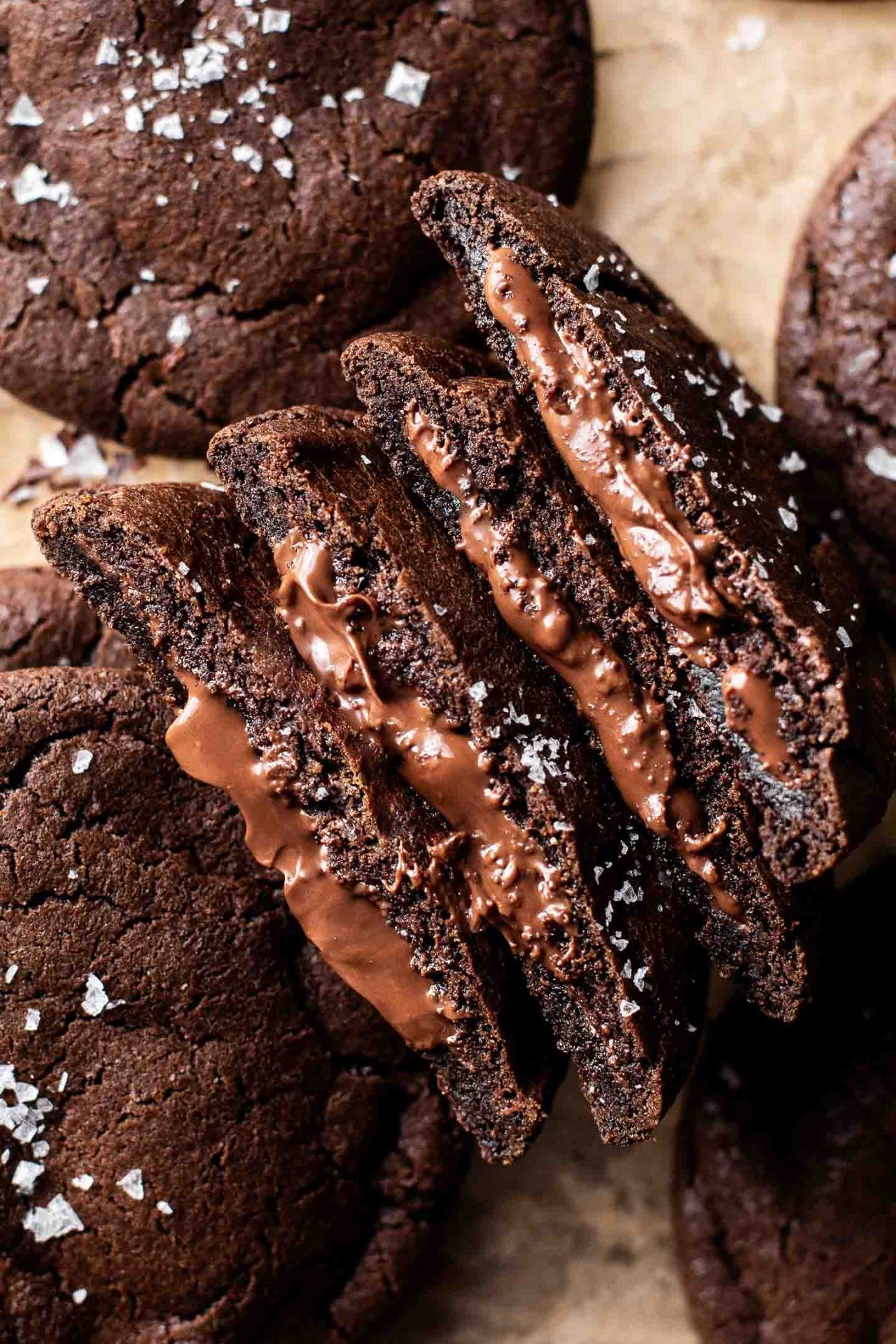 Warm Nutella stuffed cookie oozing chocolate, close-up, rustic background