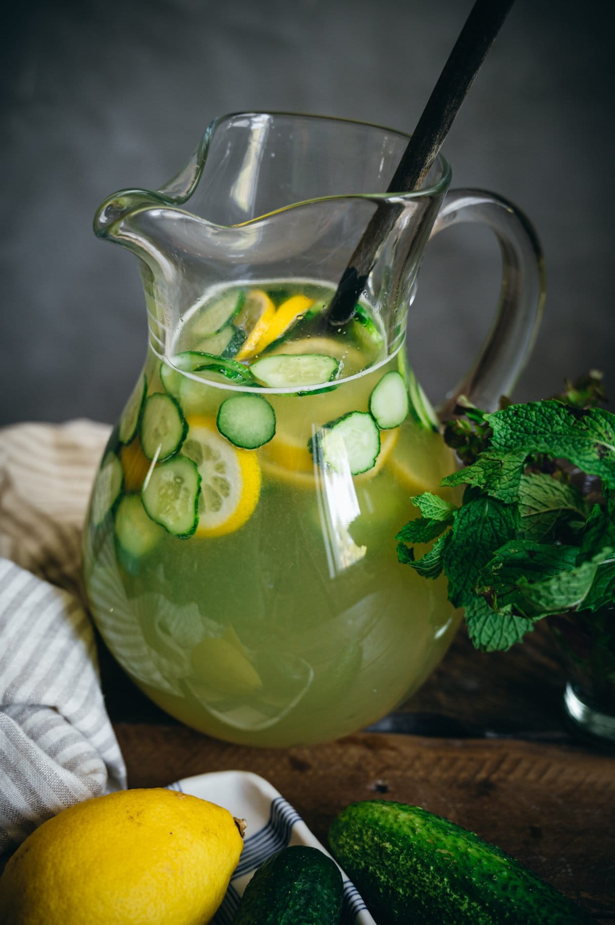 refreshing cucumber mint drink in a glass pitcher