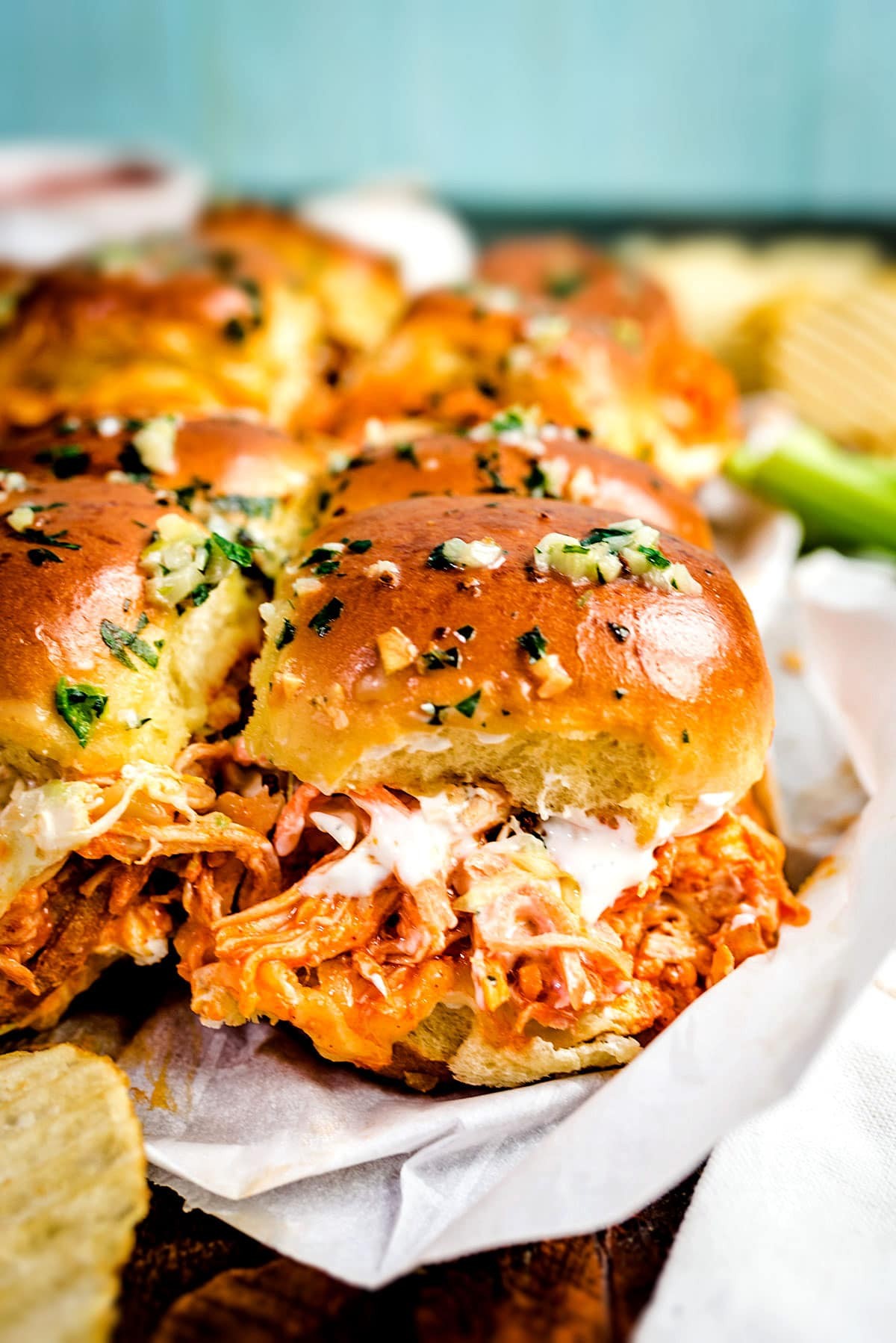 platter of buffalo chicken sliders with ranch dip