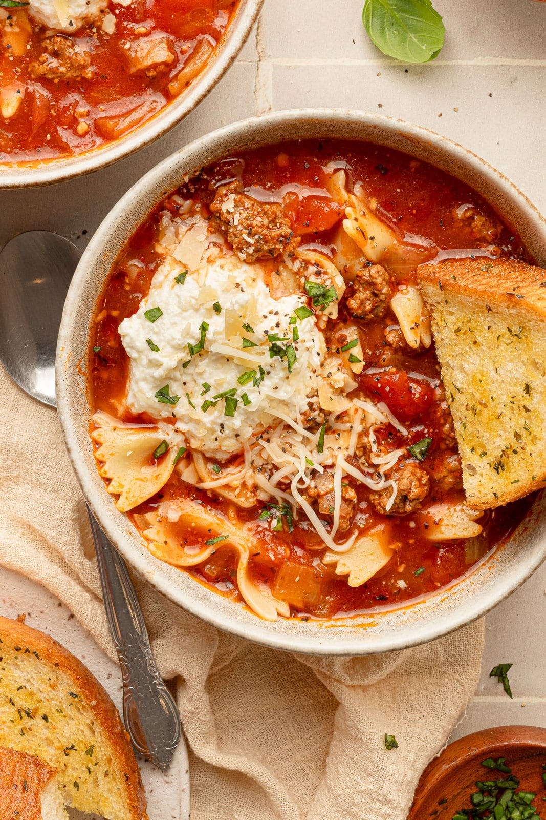 bowl of homemade lasagna soup with crusty bread