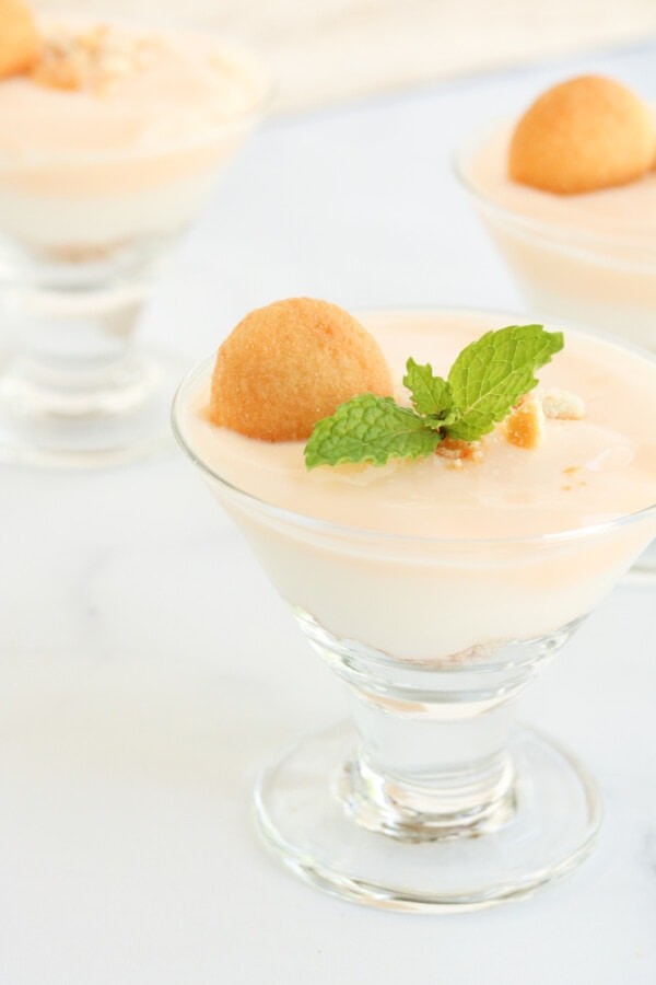 layered orange creamsicle yogurt parfait in a clear glass