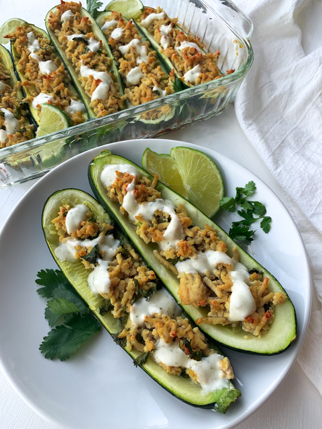 cilantro lime chicken stuffed zucchini on a plate