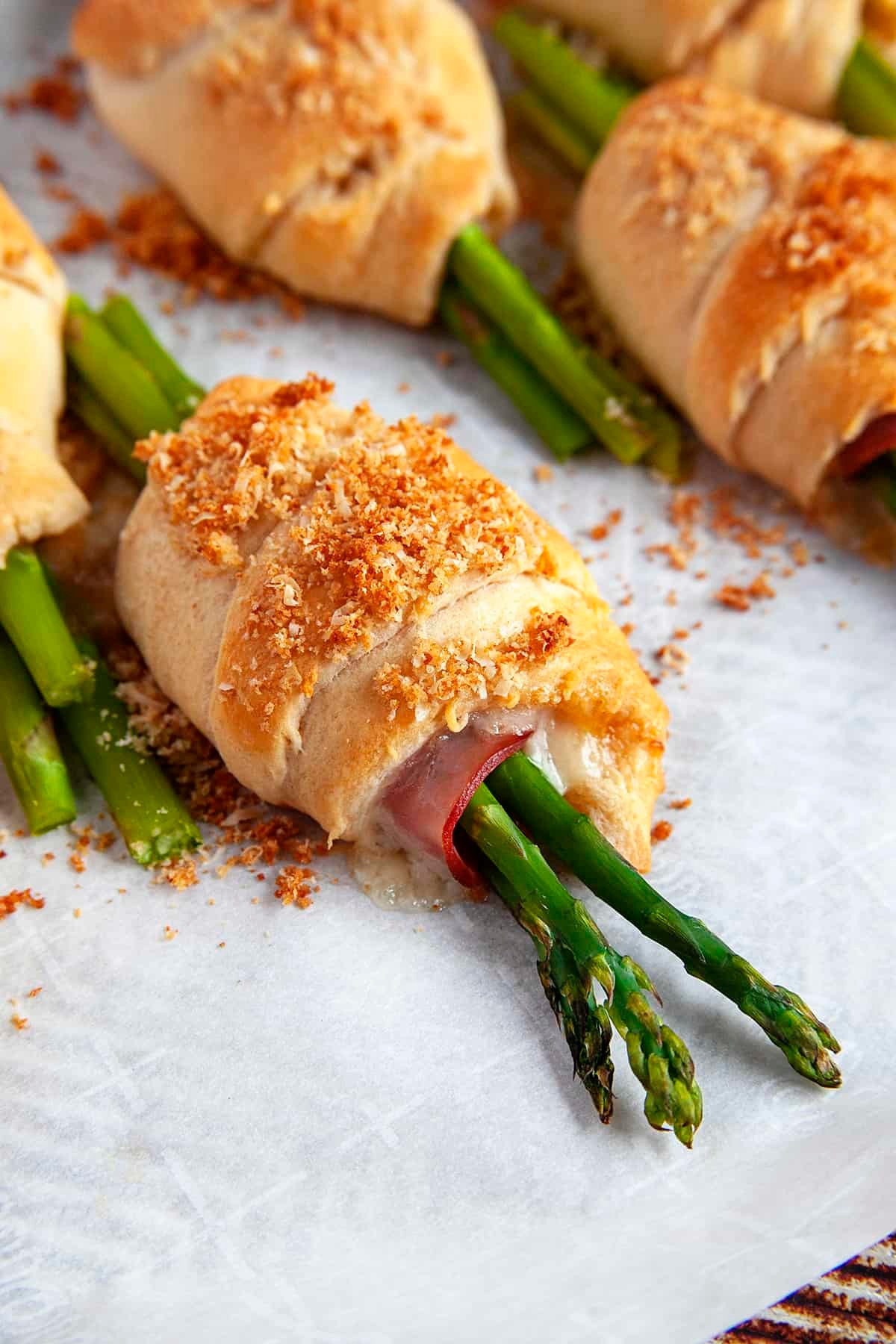 Easter ham and asparagus spring rolls on a plate