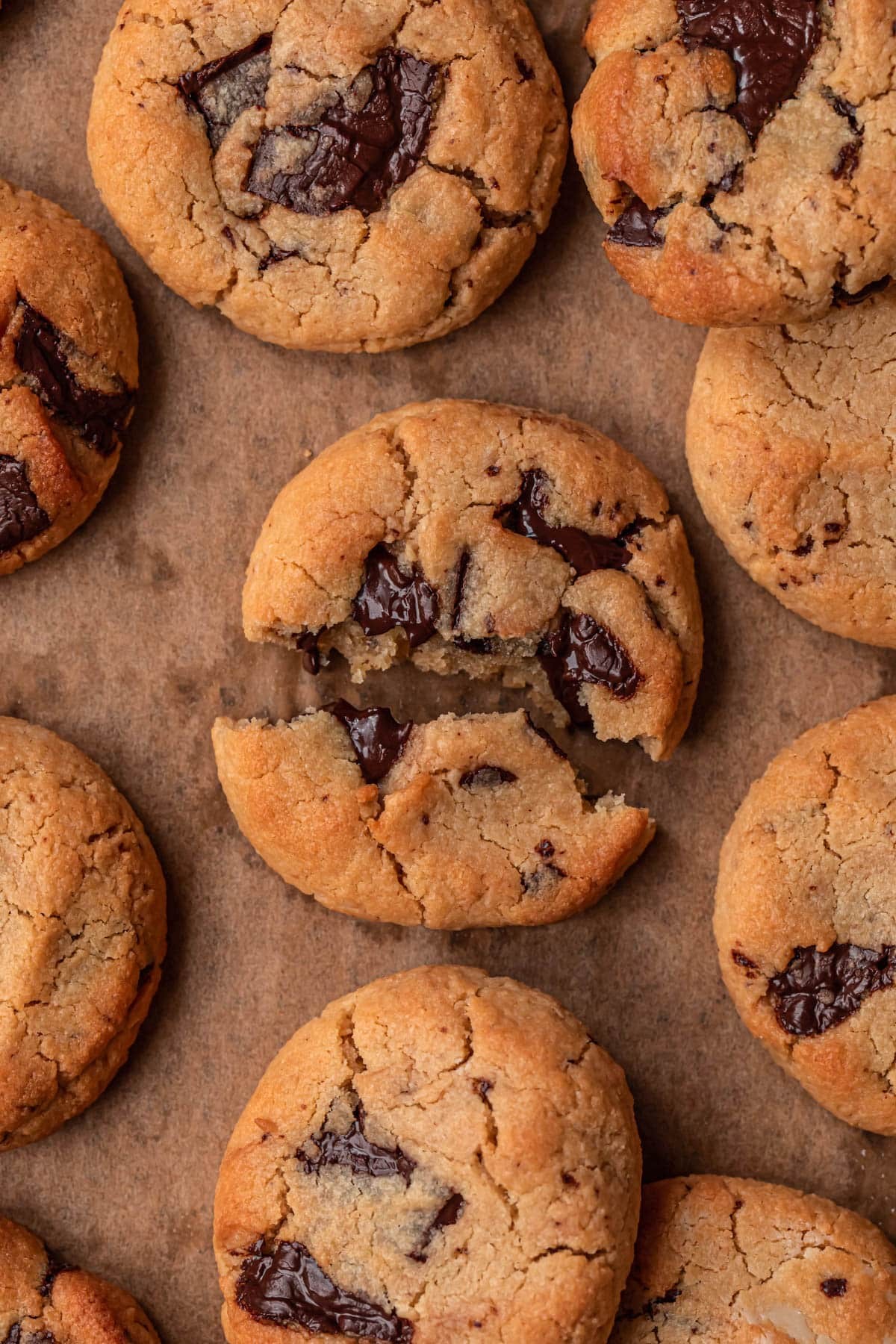 golden brown tahini chocolate chip gluten-free cookies on a baking sheet