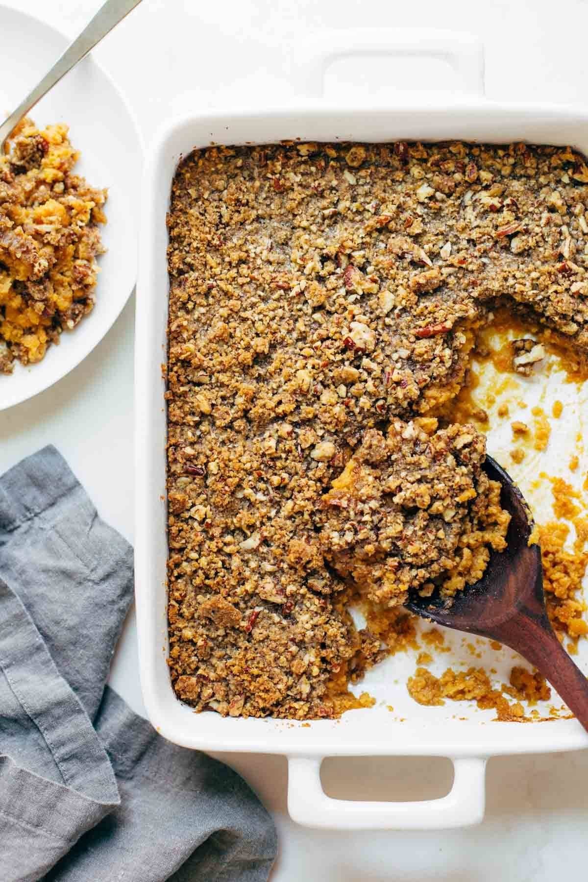 golden brown whipped sweet potato casserole with melted brown sugar topping close up