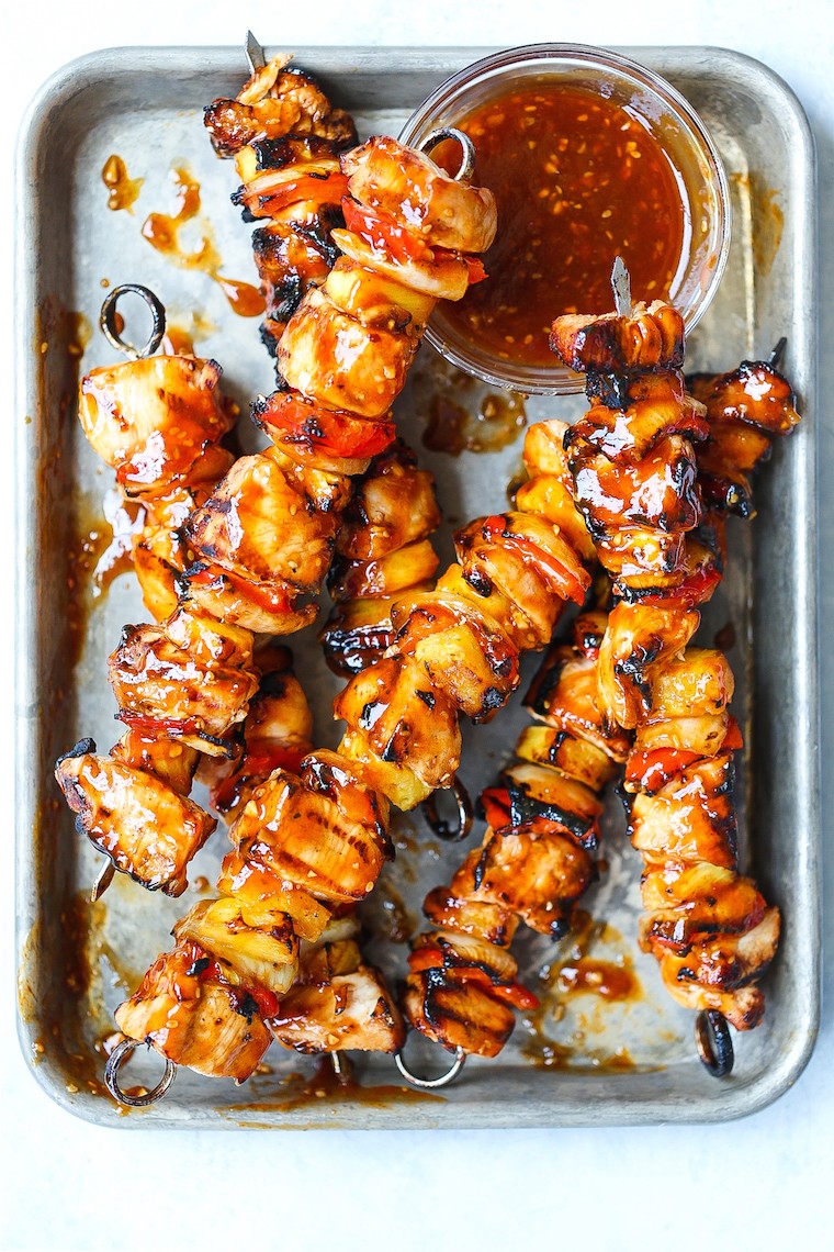 grilled chicken and pineapple skewers on a barbecue