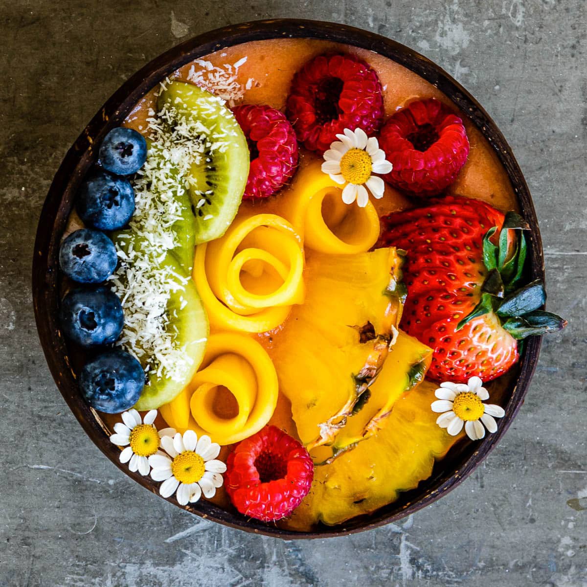vibrant tropical pineapple zoodle bowl with colorful toppings