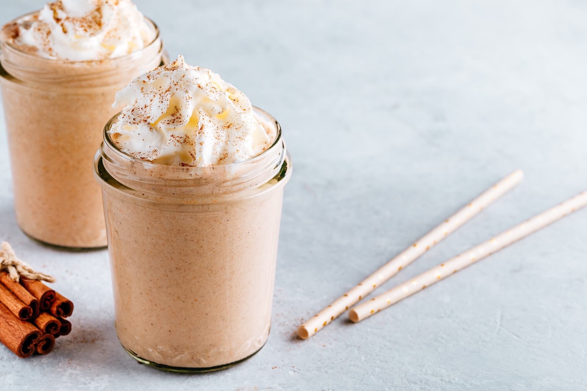 spiced apple pie milkshake with whipped cream and cinnamon