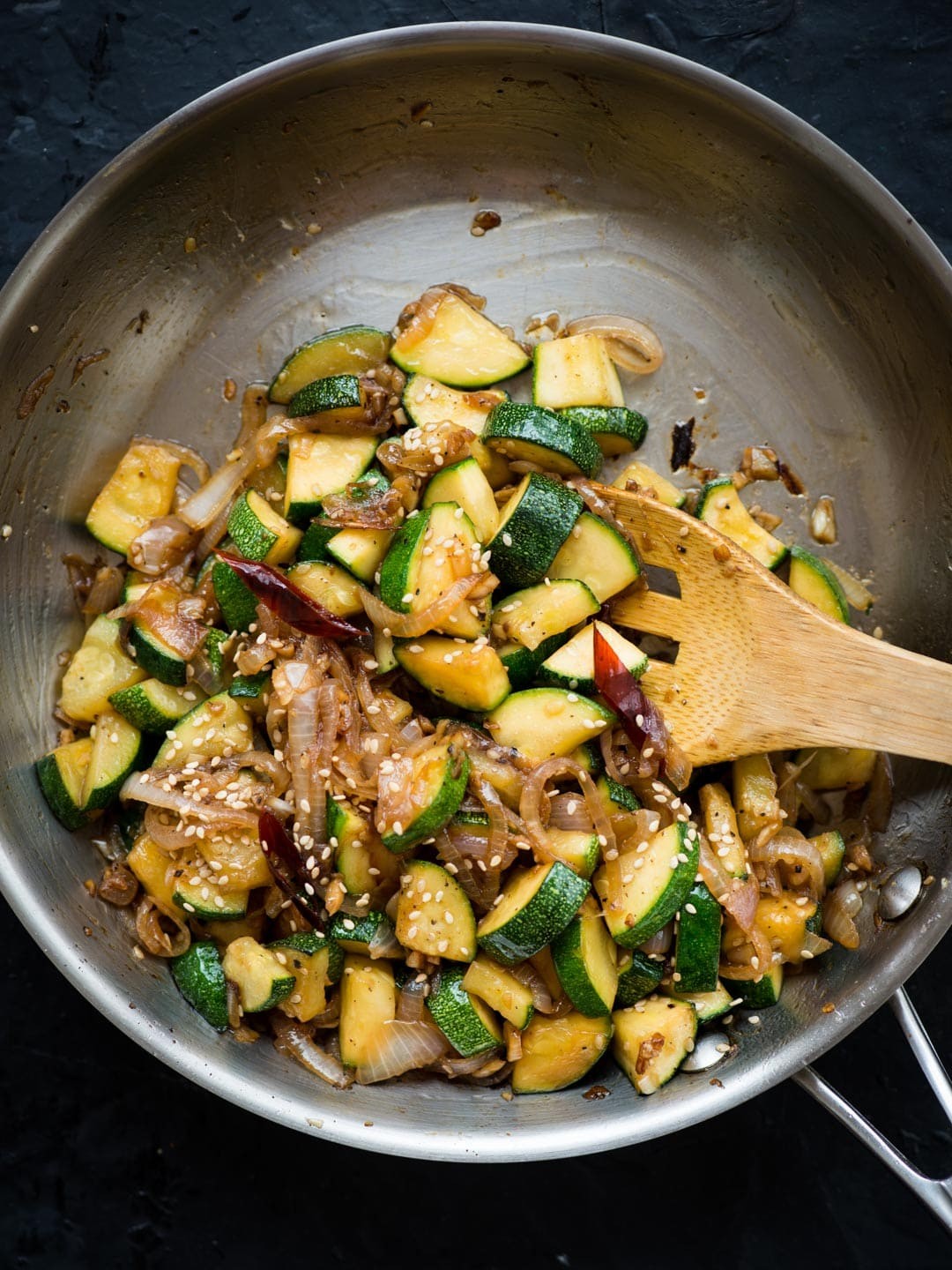 curried zucchini beef stir-fry in a wok