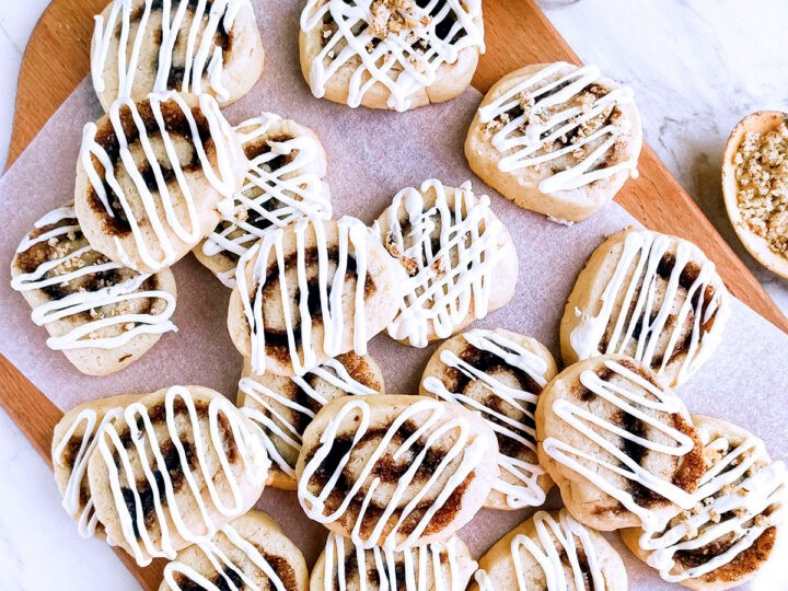 Delicious cinnamon pinwheel cookies on a cooling rack, cozy kitchen setting