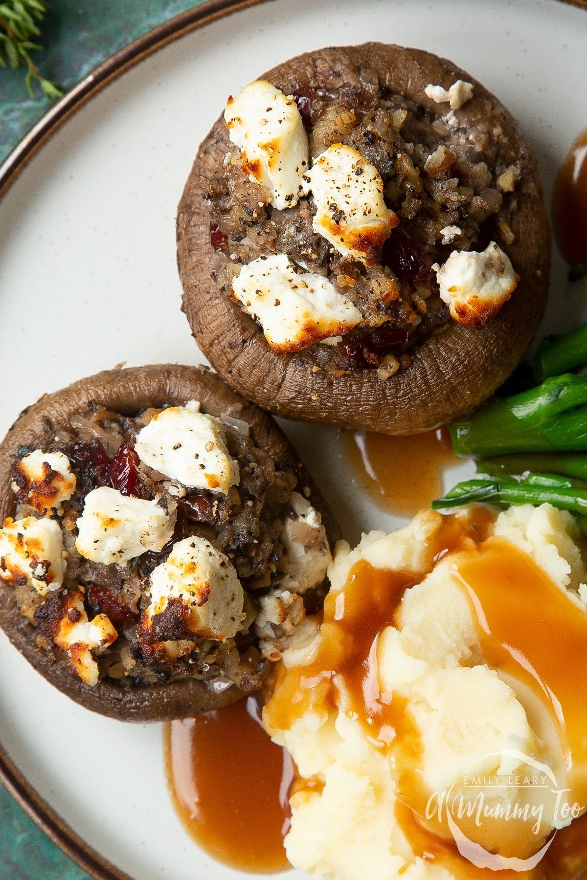 platter of golden-brown stuffed mushrooms on a festive holiday table