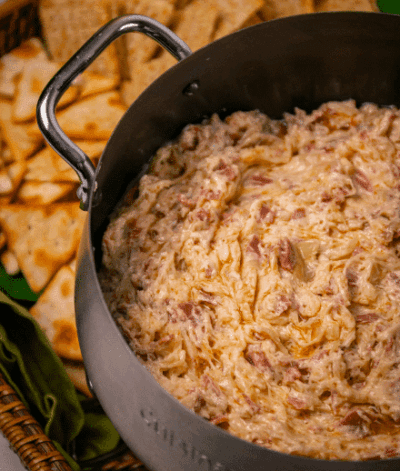 crockpot reuben dip being served at a campsite