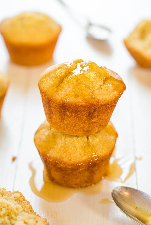 golden mini cornbread muffins drizzled with honey