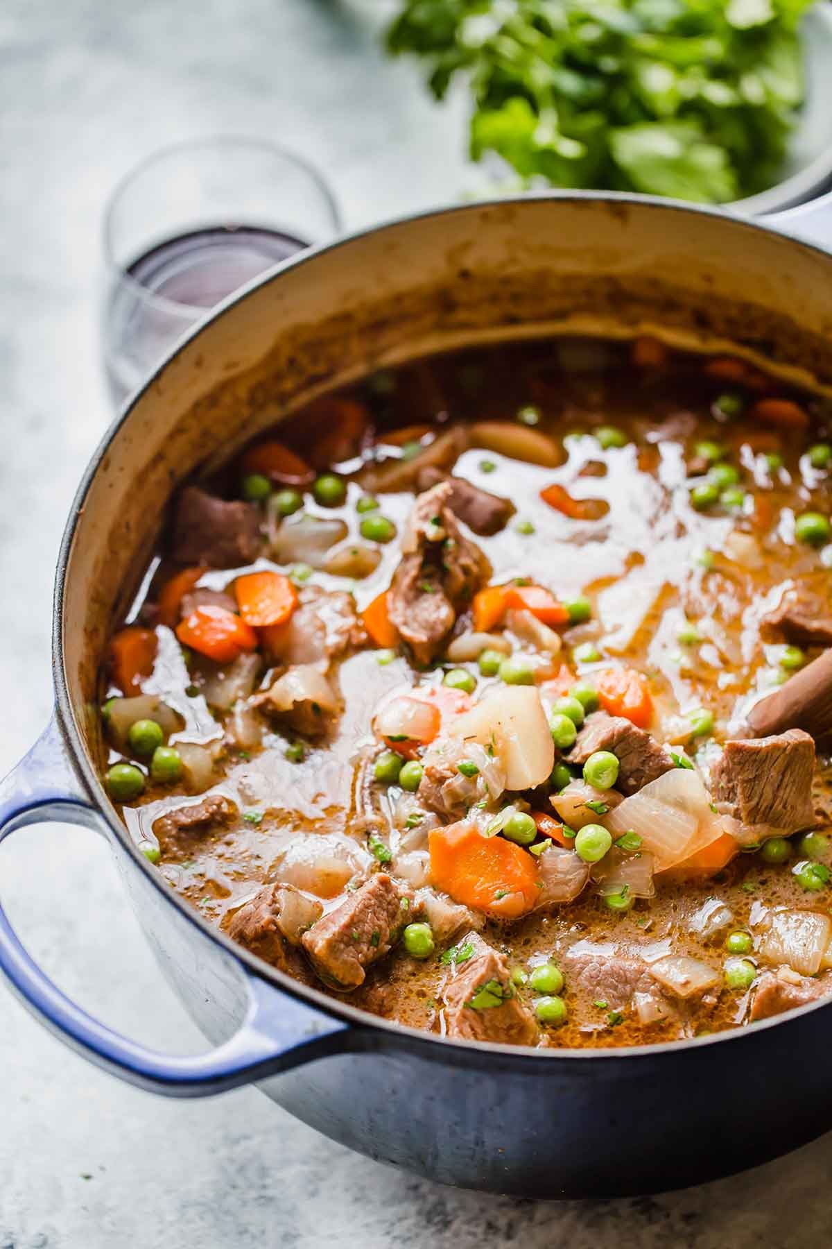 a bowl of hearty beef stew with crusty bread