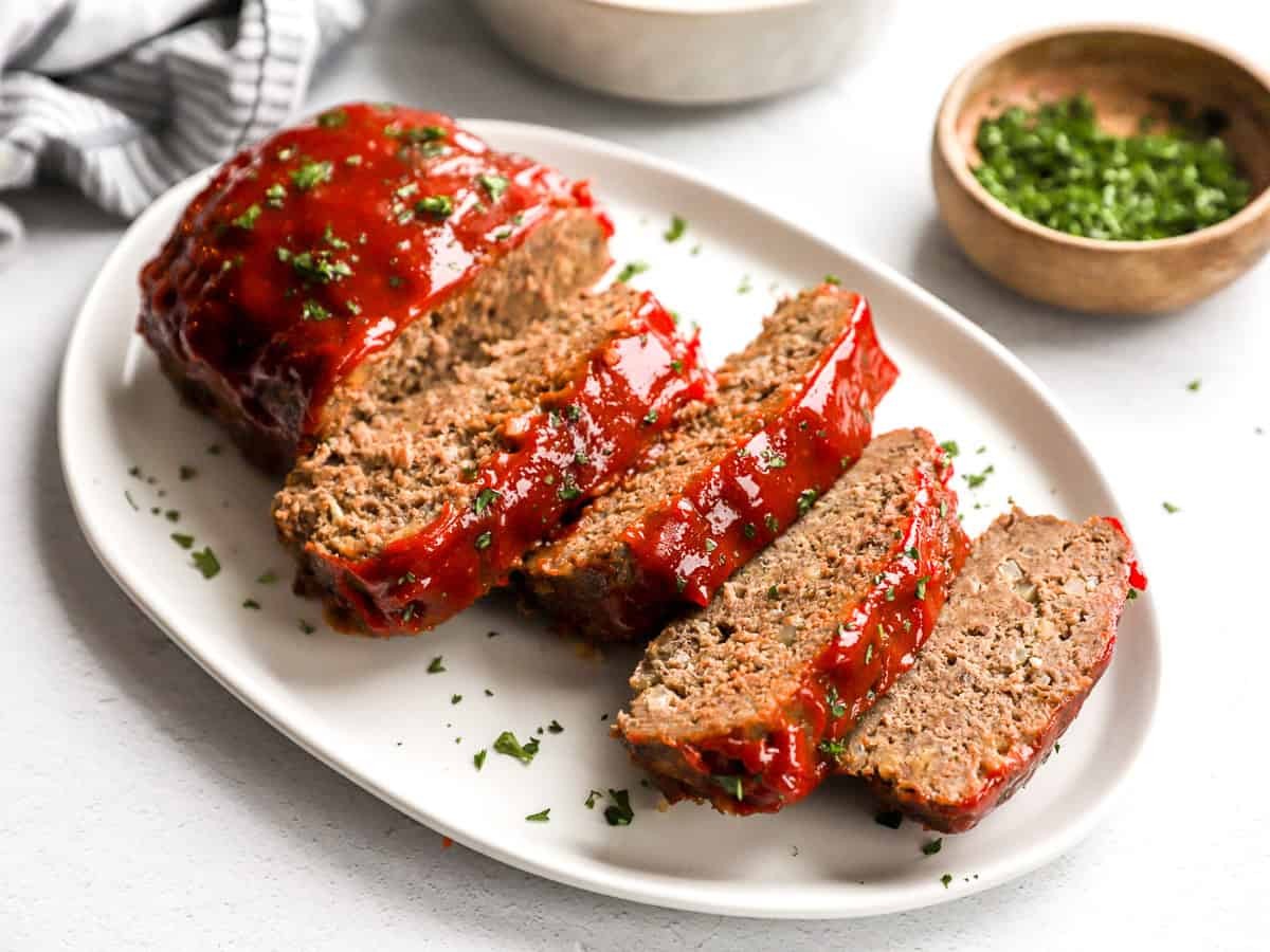 classic meatloaf with glaze being sliced