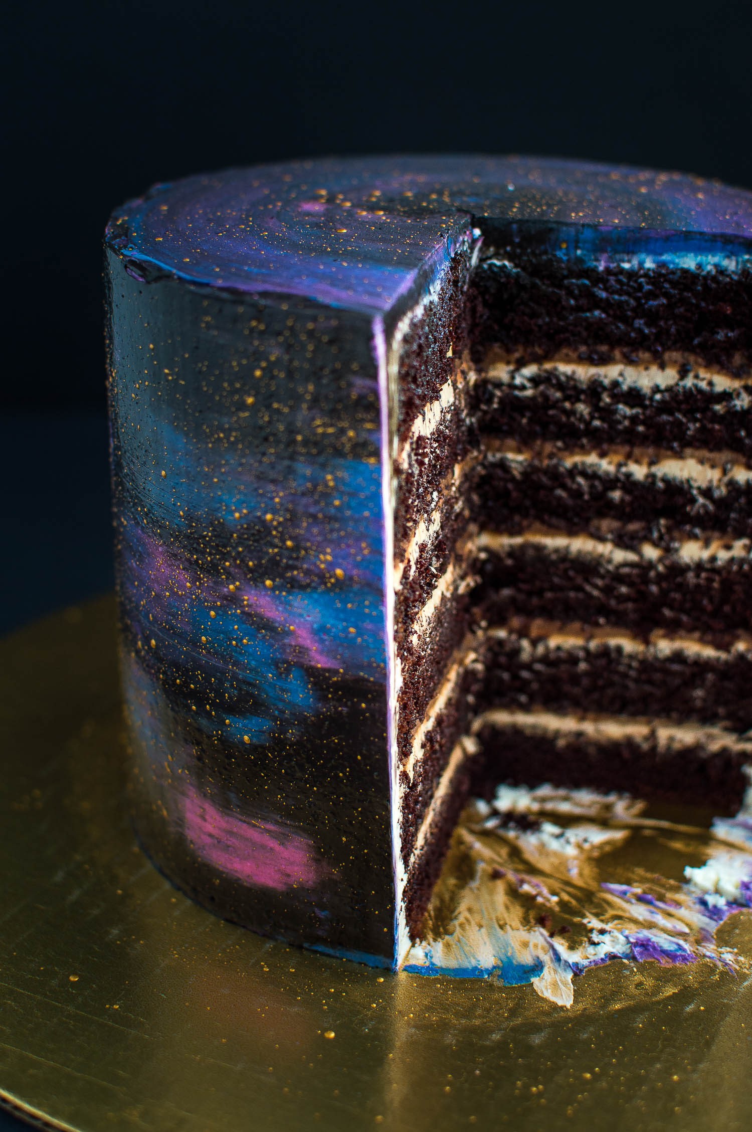 slice of layered cake with galaxy frosting