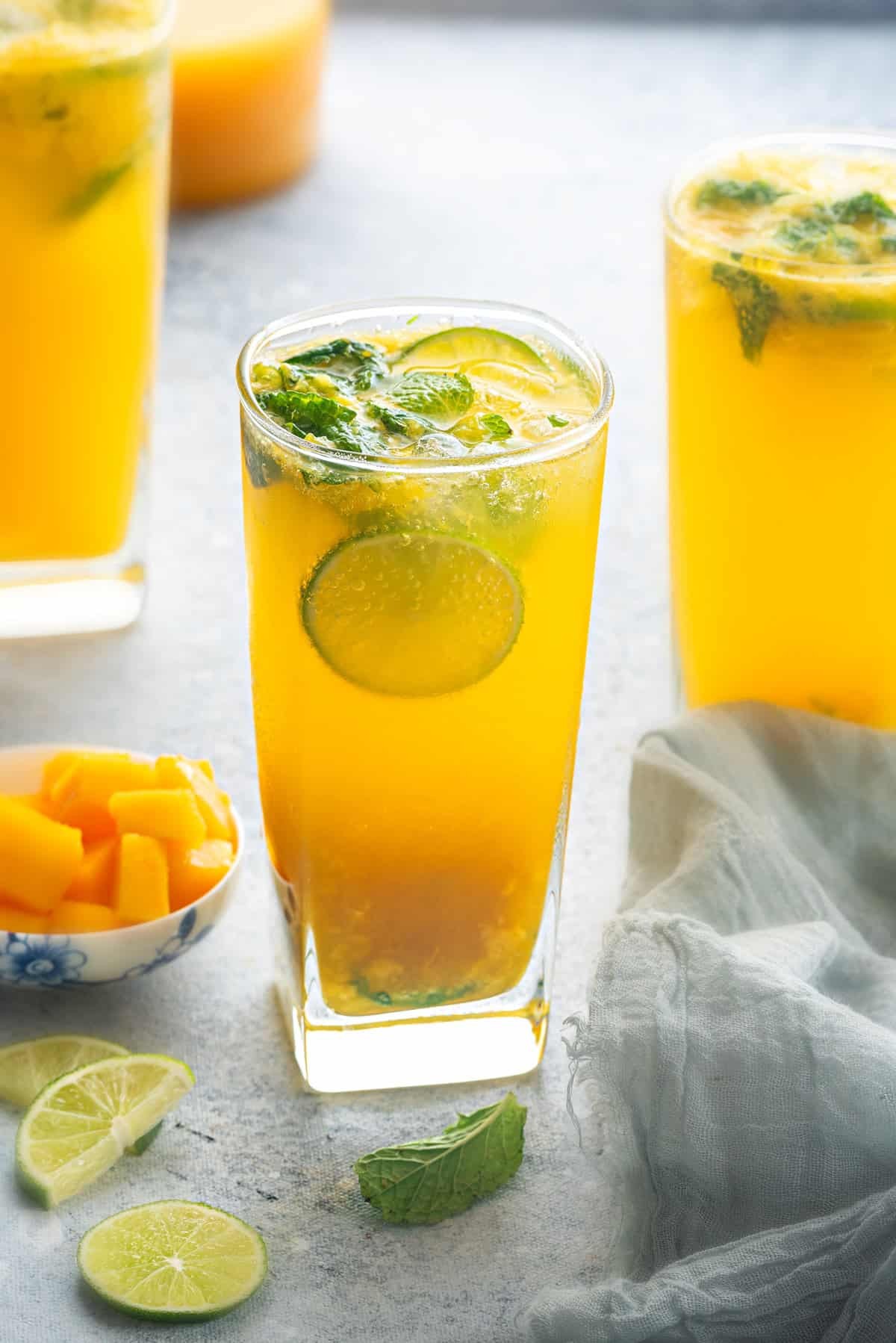 Marjoram Mango Virgin Mojito in a glass with fresh mint and mango slices