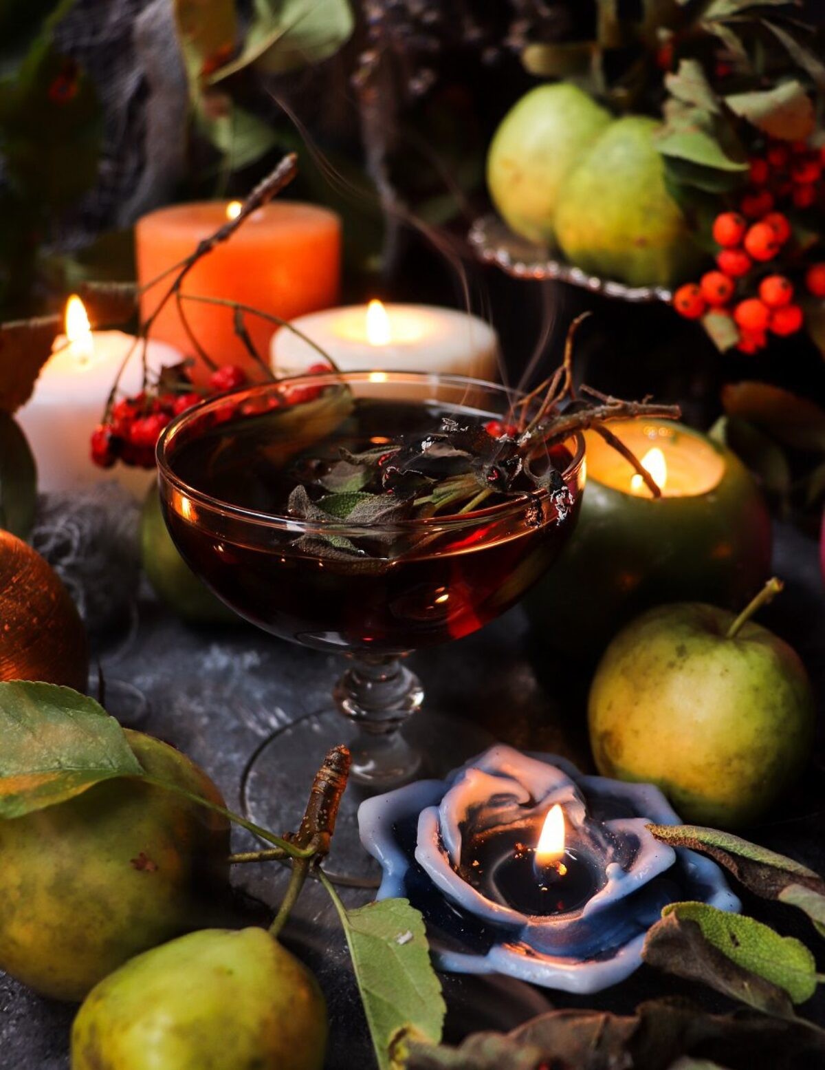 apple sage sparkle shake in a glass with fresh apples and sage leaves