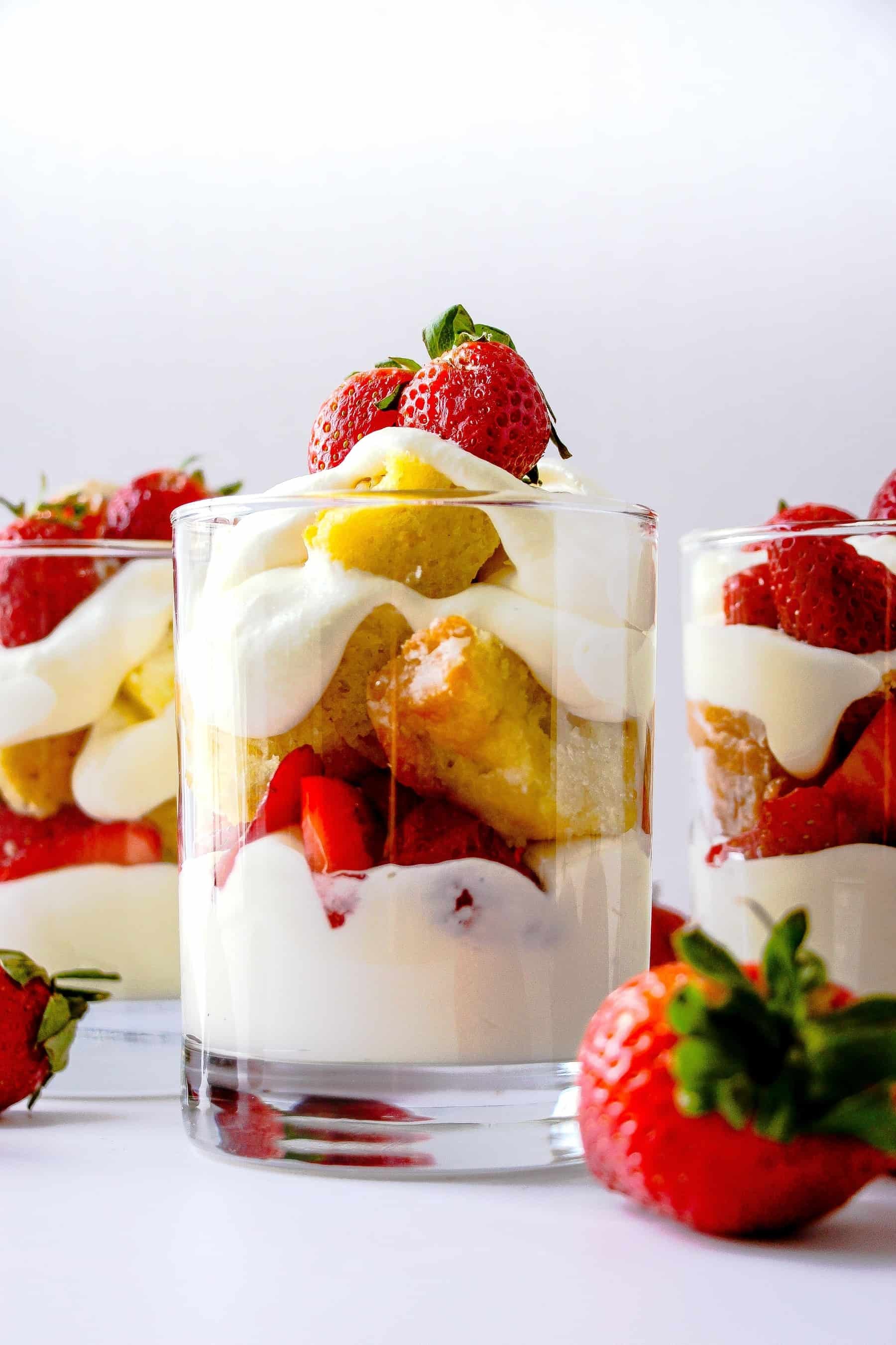 layered strawberry shortcake yogurt parfait in a glass