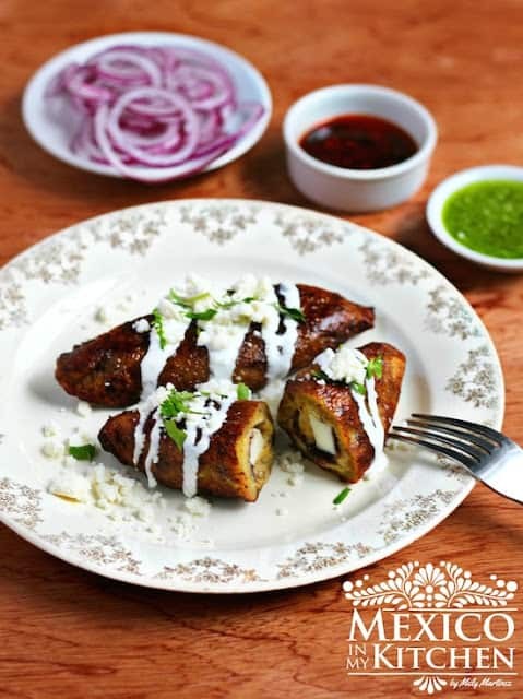 Molotes quesadillas with plantains and black beans, close-up shot