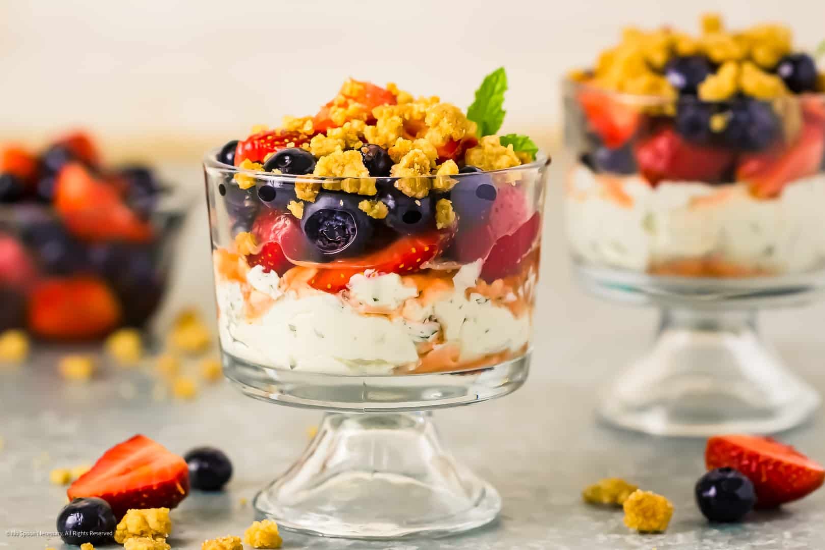 layered ginger berry parfait in a clear glass