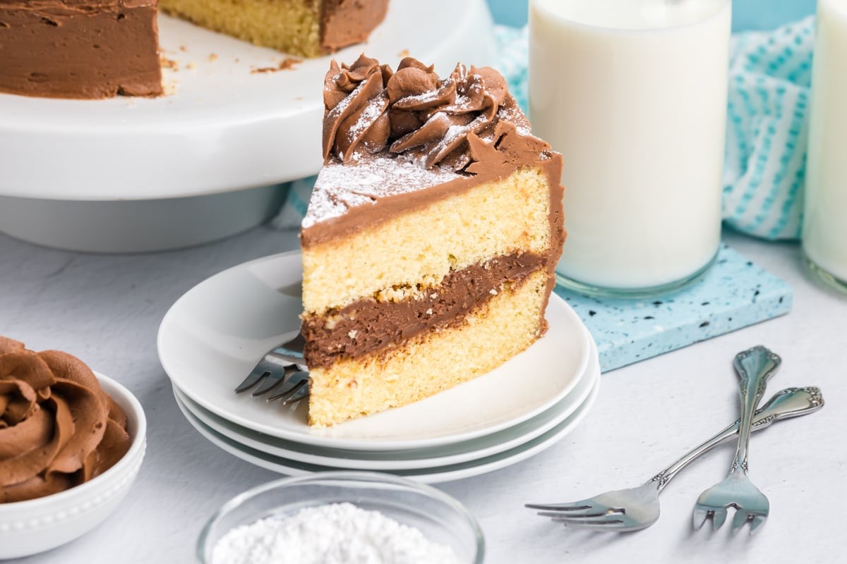 a slice of brown butter sage chocolate layer cake on a plate