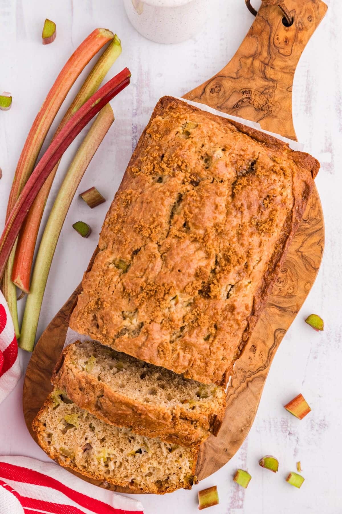 slices of hazelnut rhubarb bread on a wooden board