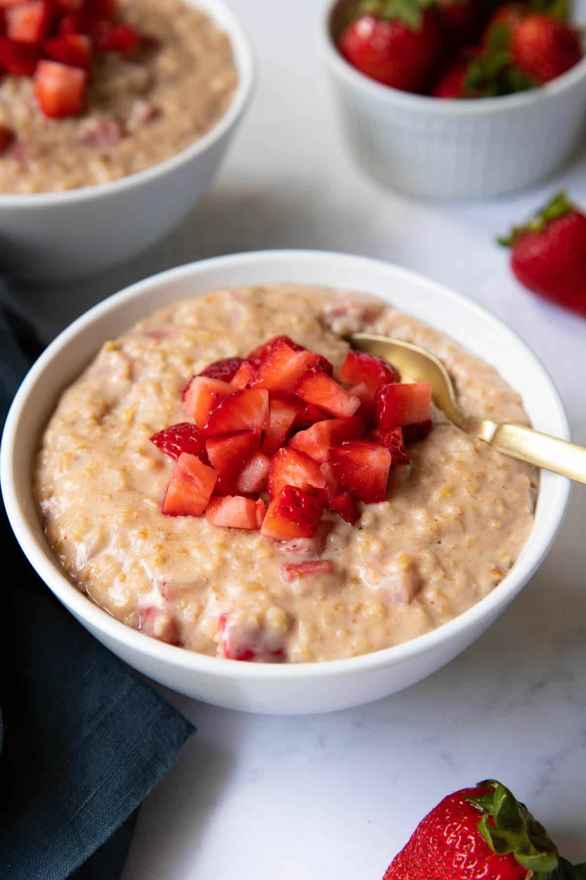 bowl of strawberry oatmeal with hemp milk