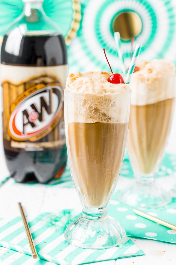 frothy homemade root beer float in a clear glass with vanilla ice cream