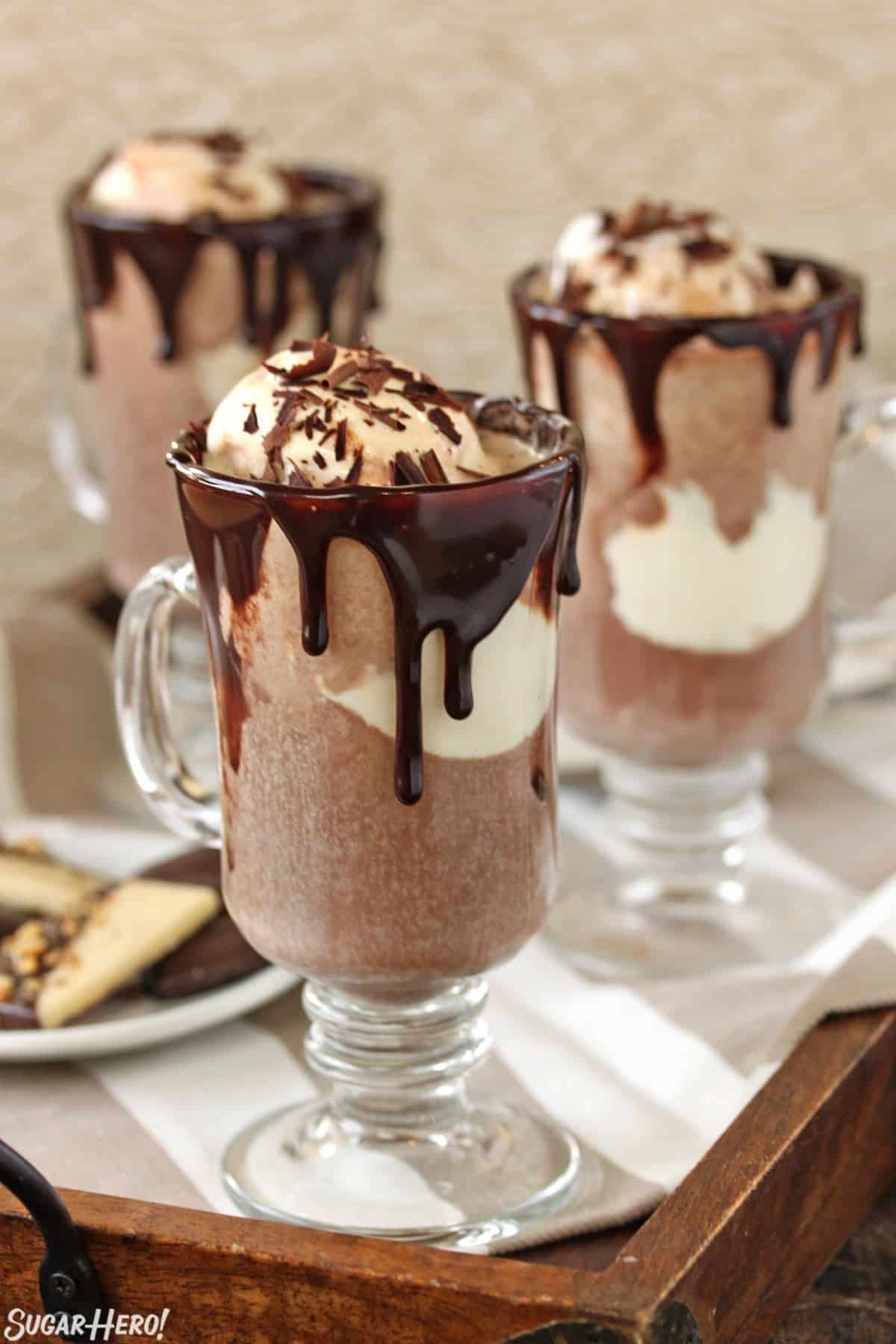 gourmet hot chocolate mug with melting truffle and whipped cream