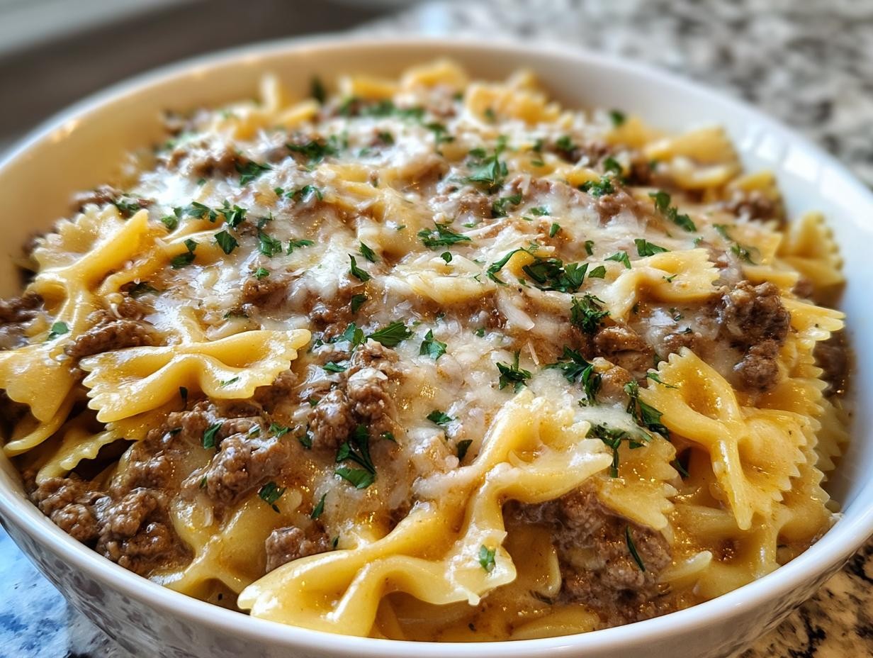 comforting creamy ground beef pasta dish with fresh parsley on a rustic wooden table, cozy setting