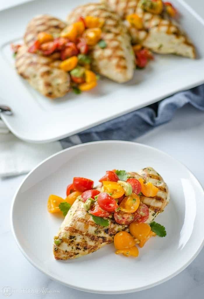 vibrant healthy avocado dinner plate with grilled chicken and fresh vegetables