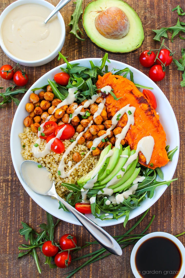 quinoa bowl with roasted sweet potatoes, avocado, and cilantro, bright summer lighting