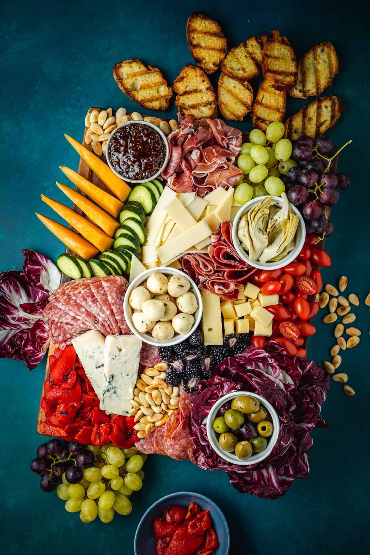 overhead shot of a vibrant mediterranean cheese and antipasto platter
