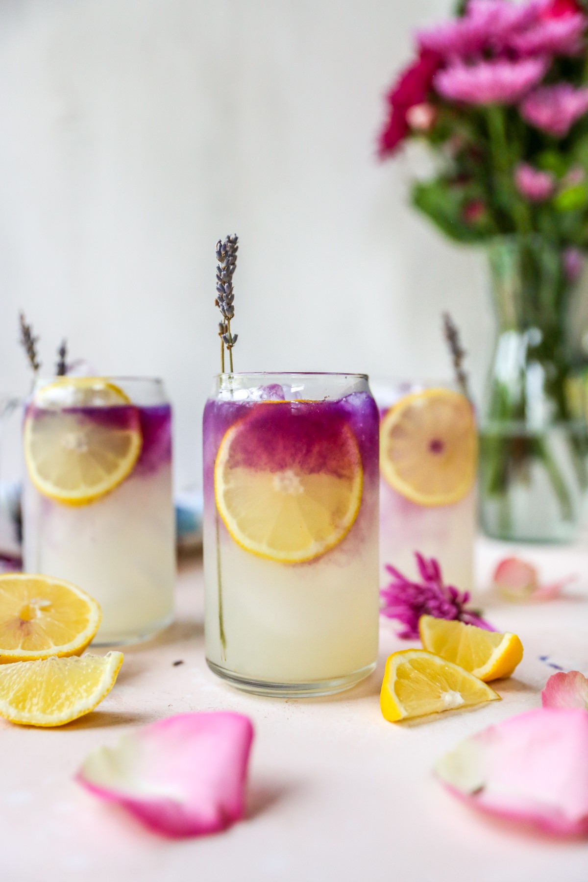 lavender lemonade hugo cocktail with lemon slices and lavender sprigs