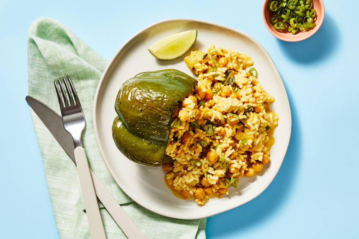 Coconut Curry Stuffed Bell Peppers with Shrimp & Vegetables served on a plate